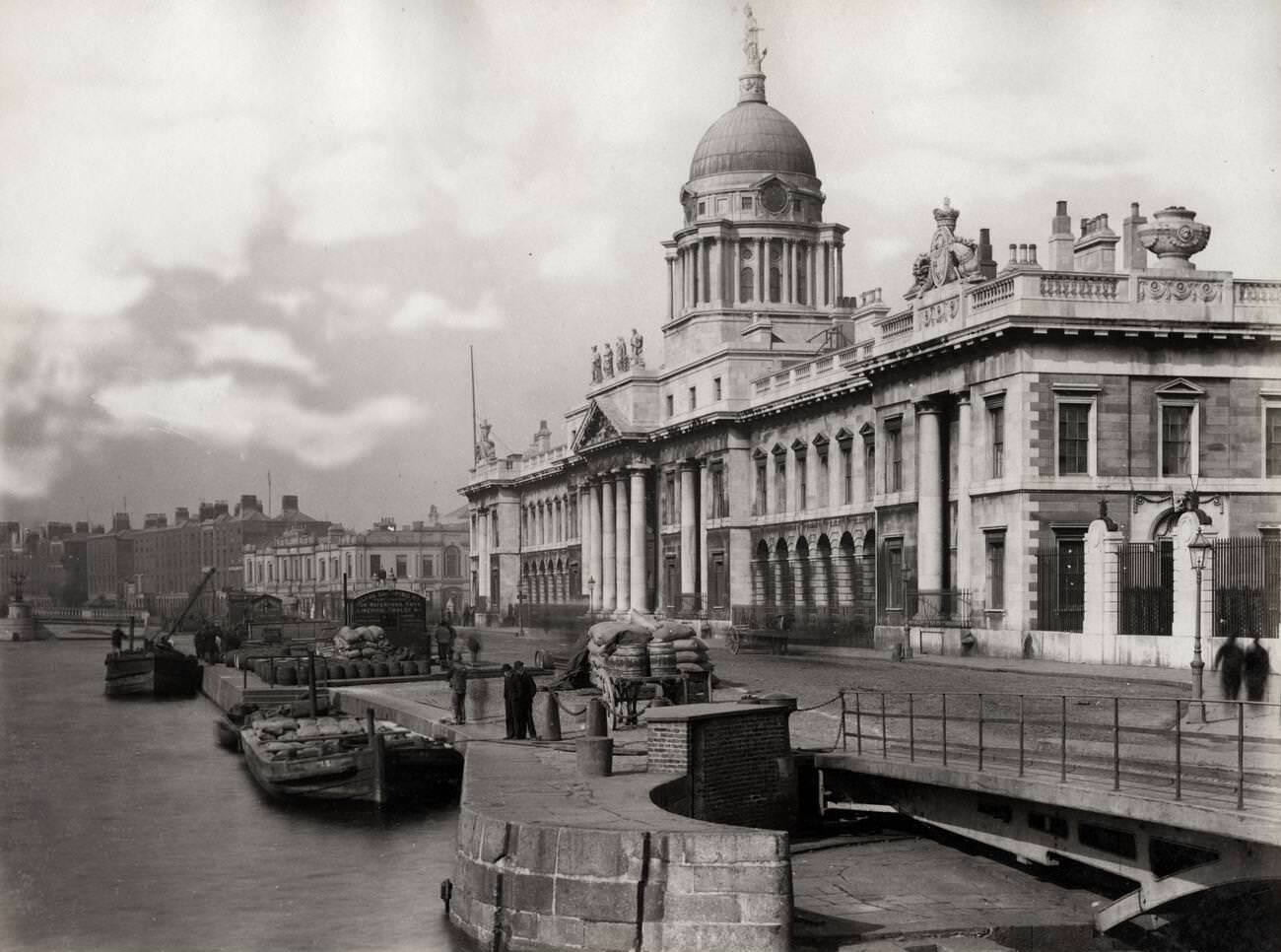 Barges for freight tied up outside the Customs House on the River Liffey, Dublin.