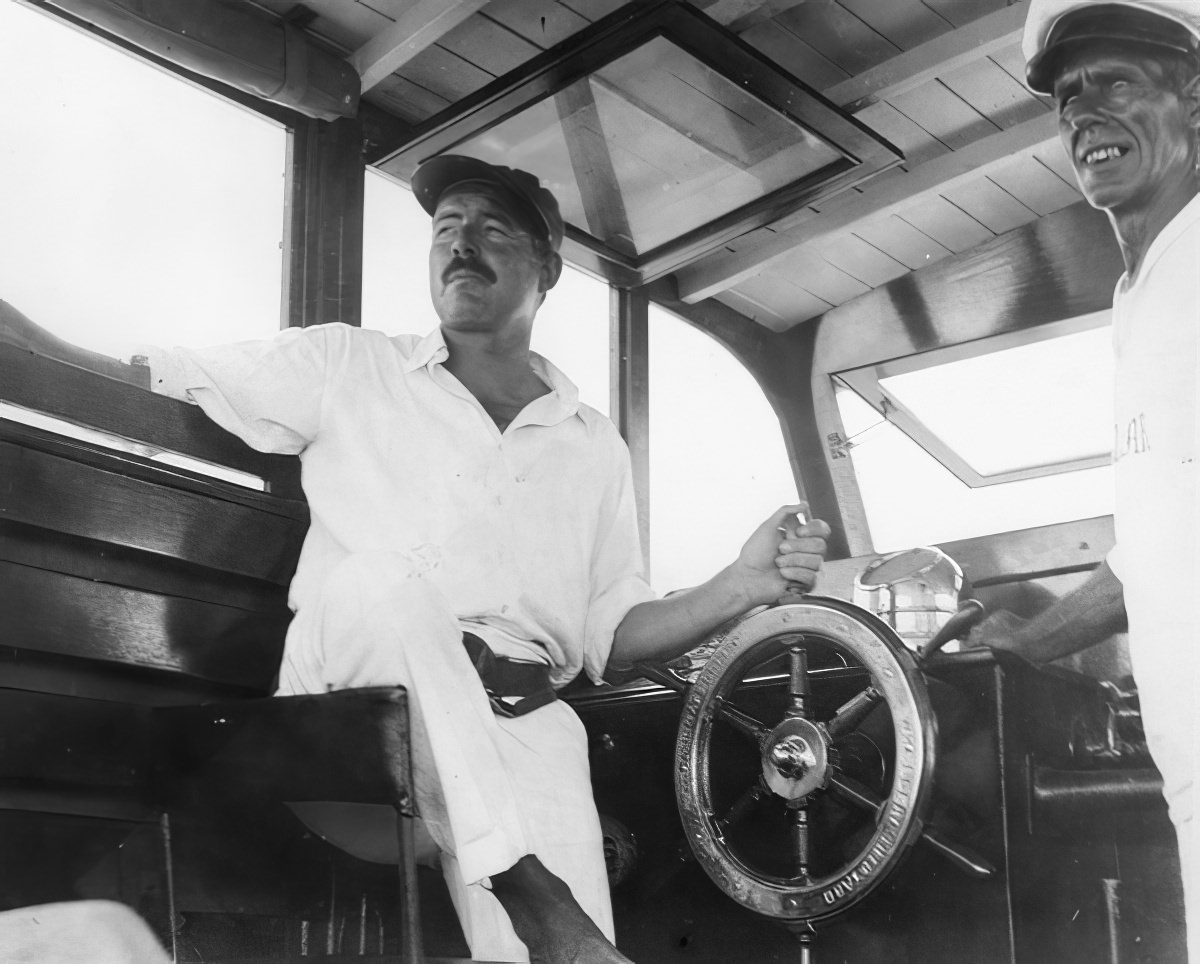 Ernest Hemingway and friend Carlos Gutierrez partying Hemingway's fishing boat, the Pilar, in 1934
