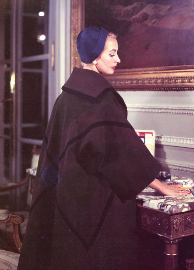 Marie-Thérèse in Balmain's plaid wool coat of assembled panels, 1957.