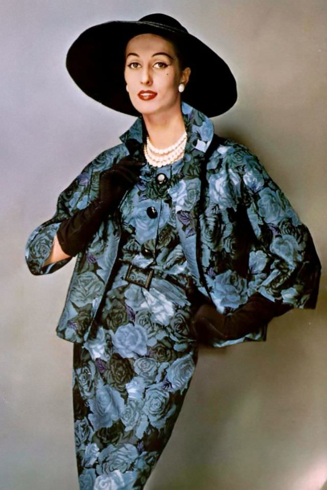 Marina Nicolaïdes in a crepe sheath dress and short jacket in a blue and green rose print by Pierre Balmain, 1957.