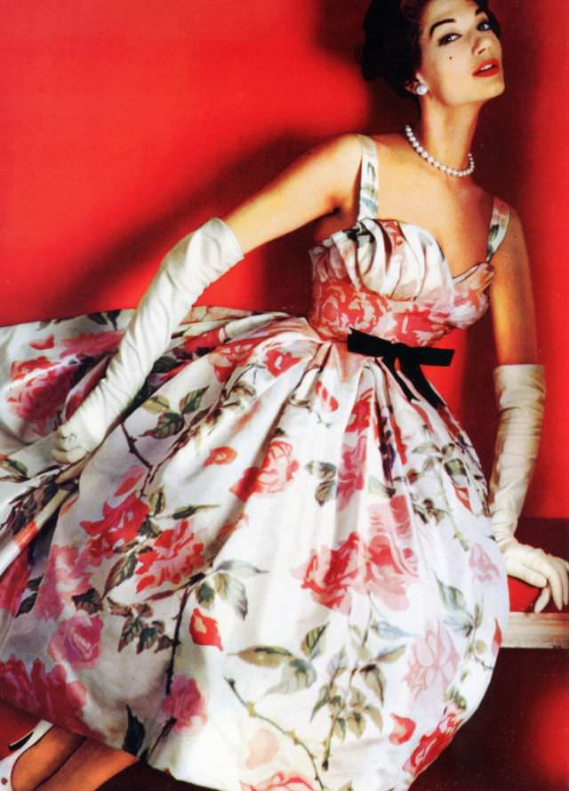 Simone d'Aillencourt in a pink crepe de chine floral party dress by Pierre Balmain, 1957.