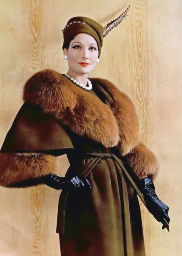 Bronwen Pugh (Lady Astor) in a wool wrap coat with a red fox collar and cuffs by Pierre Balmain, 1958.