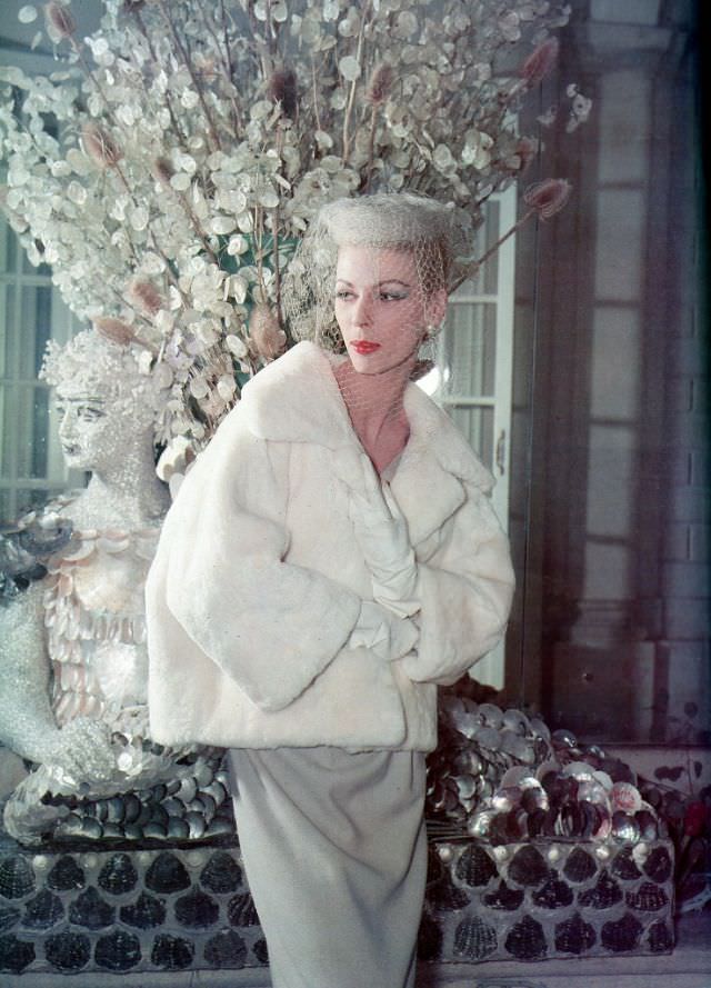 Dorothy is wearing Balmain's short fur jacket, 1959.