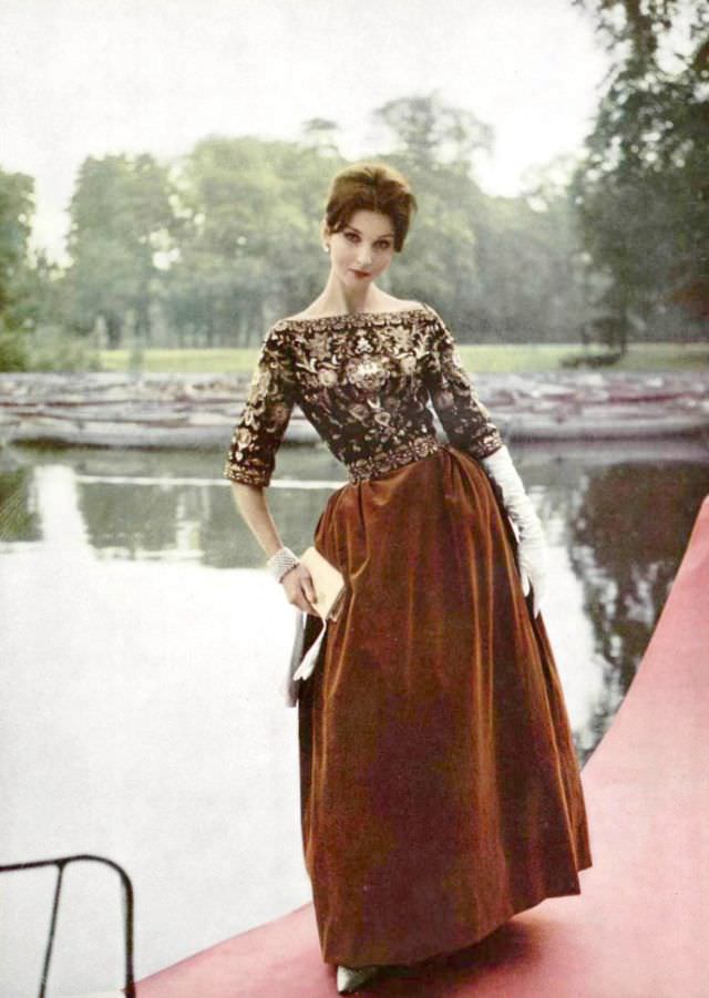 A model in a long velvet skirt reminiscent of the Renaissance, the bodice is richly embroidered chiffon, by Pierre Balmain, 1959.