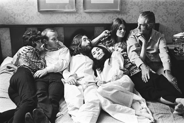 The following photographs are previously unseen images of John Lennon and Yoko Ono during their "Bed In" for peace at Montreal's Queen Elizabeth Hotel in June 1969. Here, Tommy Smothers, an unknown friend, John Lennon, Yoko Ono, Rosemary Leary and Timothy Leary.