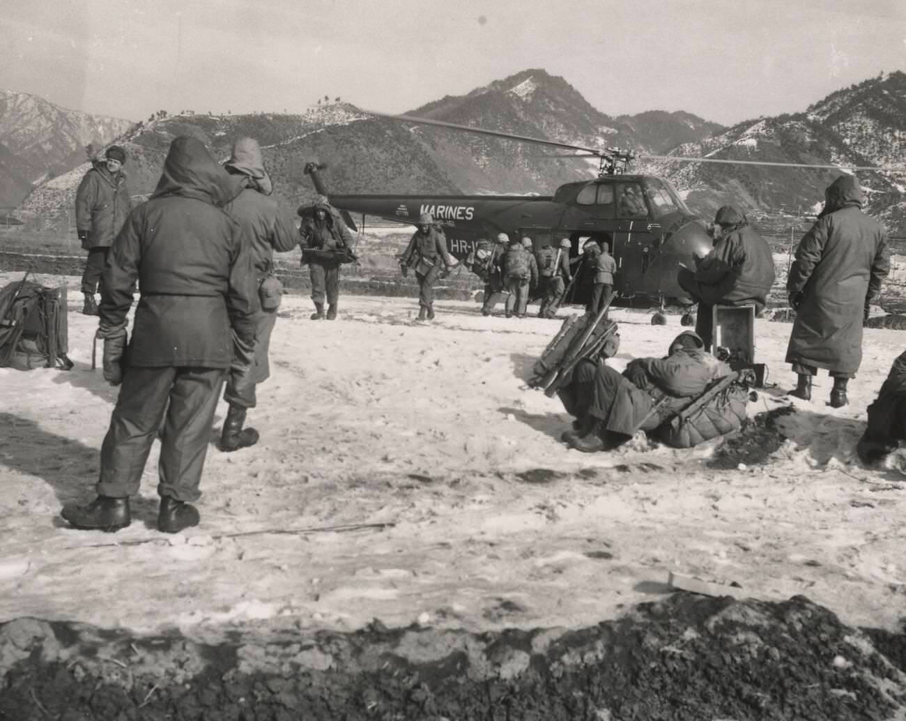 Leathernecks of the First Marine Division in Korea climb aboard a large transport helicopter, 1950s.