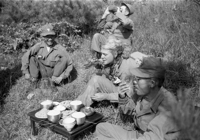 LIFE's Margaret Bourke-White shares a meal with South Korean troops, 1952.