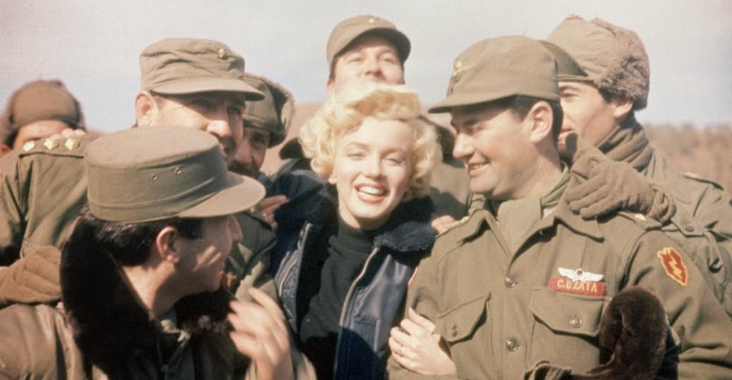 American movie actress Marilyn Monroe entertains a group of soldiers in Korea.