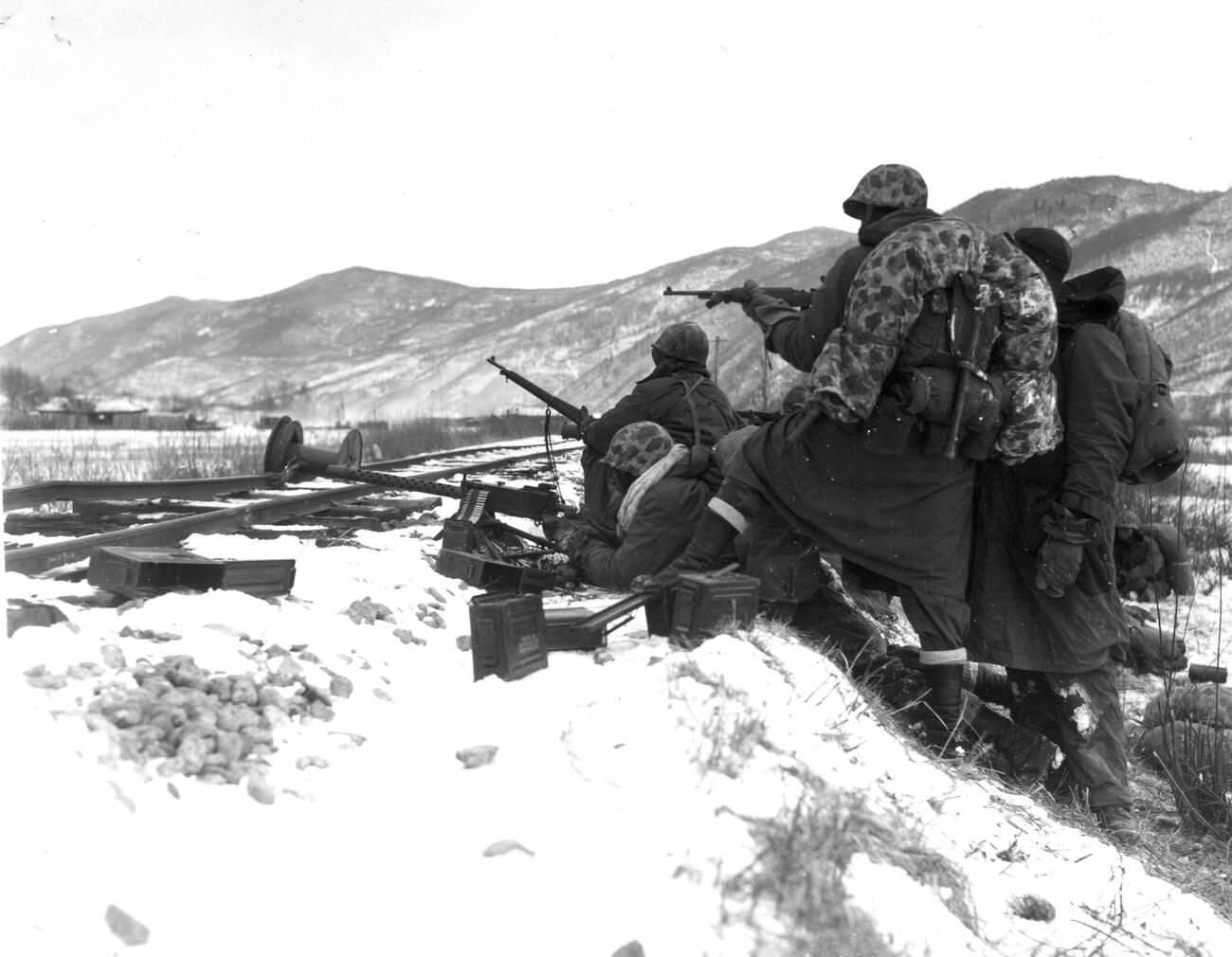 First Division Leathernecks counter fire when attacked by well-entrenched Chinese Communist troops during the Division's heroic breakout from Chosin, 1950s.