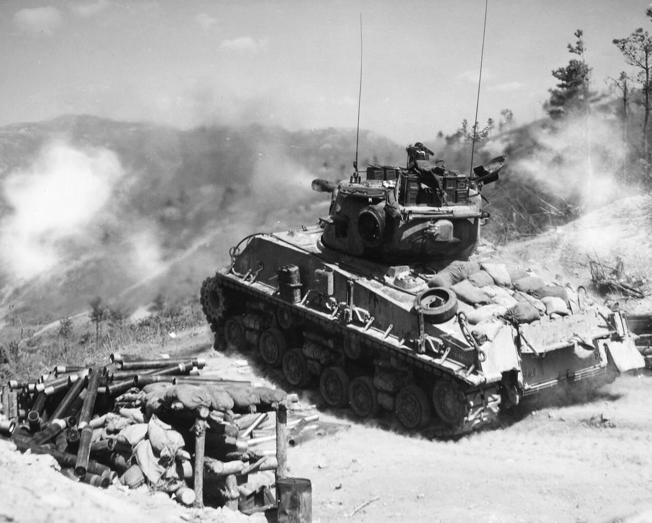 A tank of the 2nd Infantry Division fires on Communist bunkers on the Korean front, 1952.