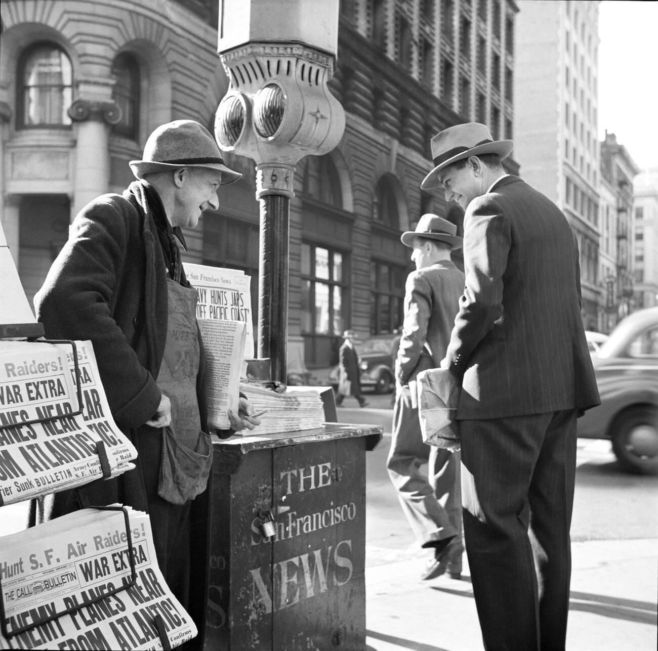 Two men at a newsstand on the corner of Montgomery and Market Streets, San Francisco, California, USA, 1941.