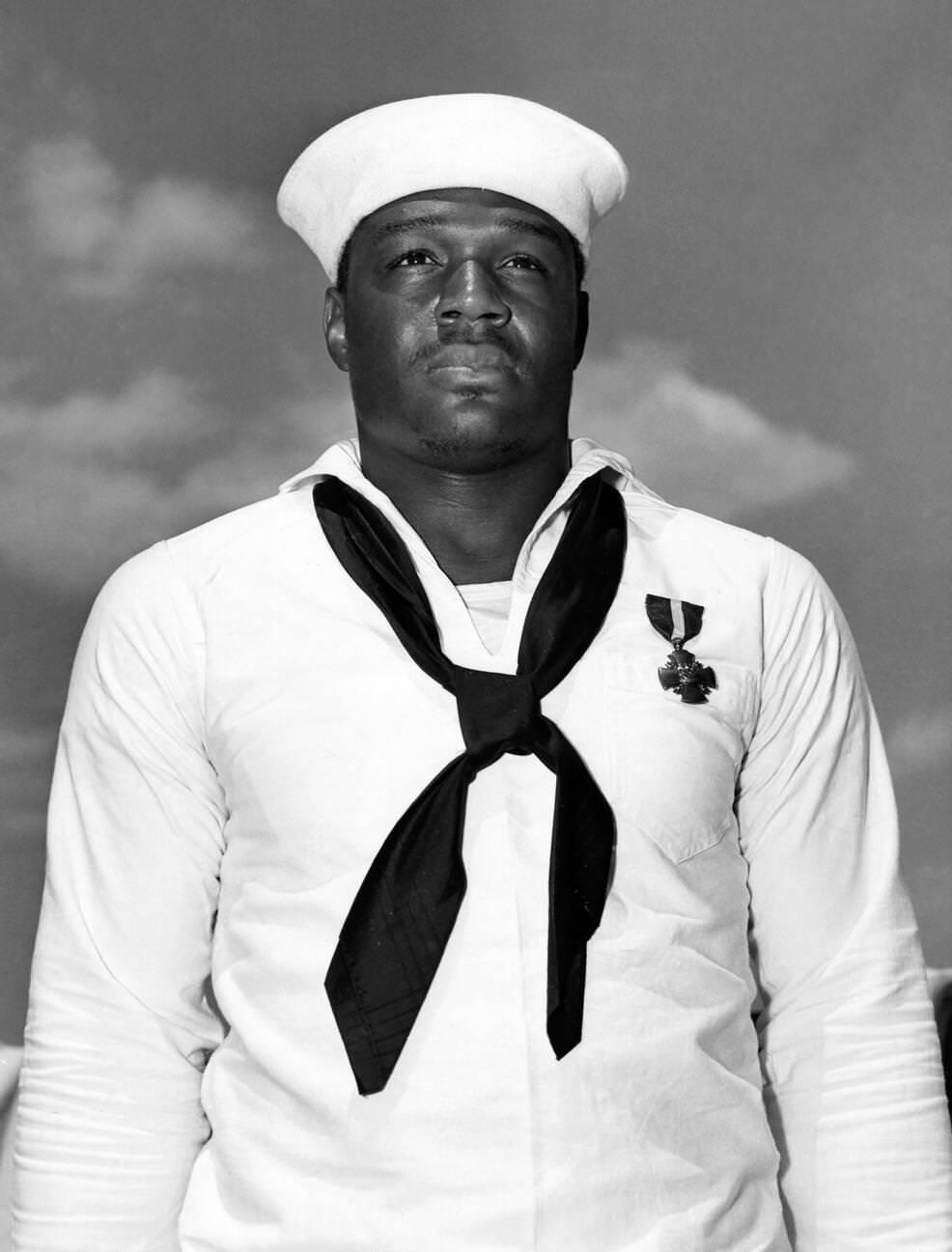 Doris "Dorie" Miller, a Messmen Third Class in the United States Navy noted for his bravery during the attack on Pearl Harbor on December 7, 1941. He was awarded the Navy Cross for his actions, the first black American to receive the award.