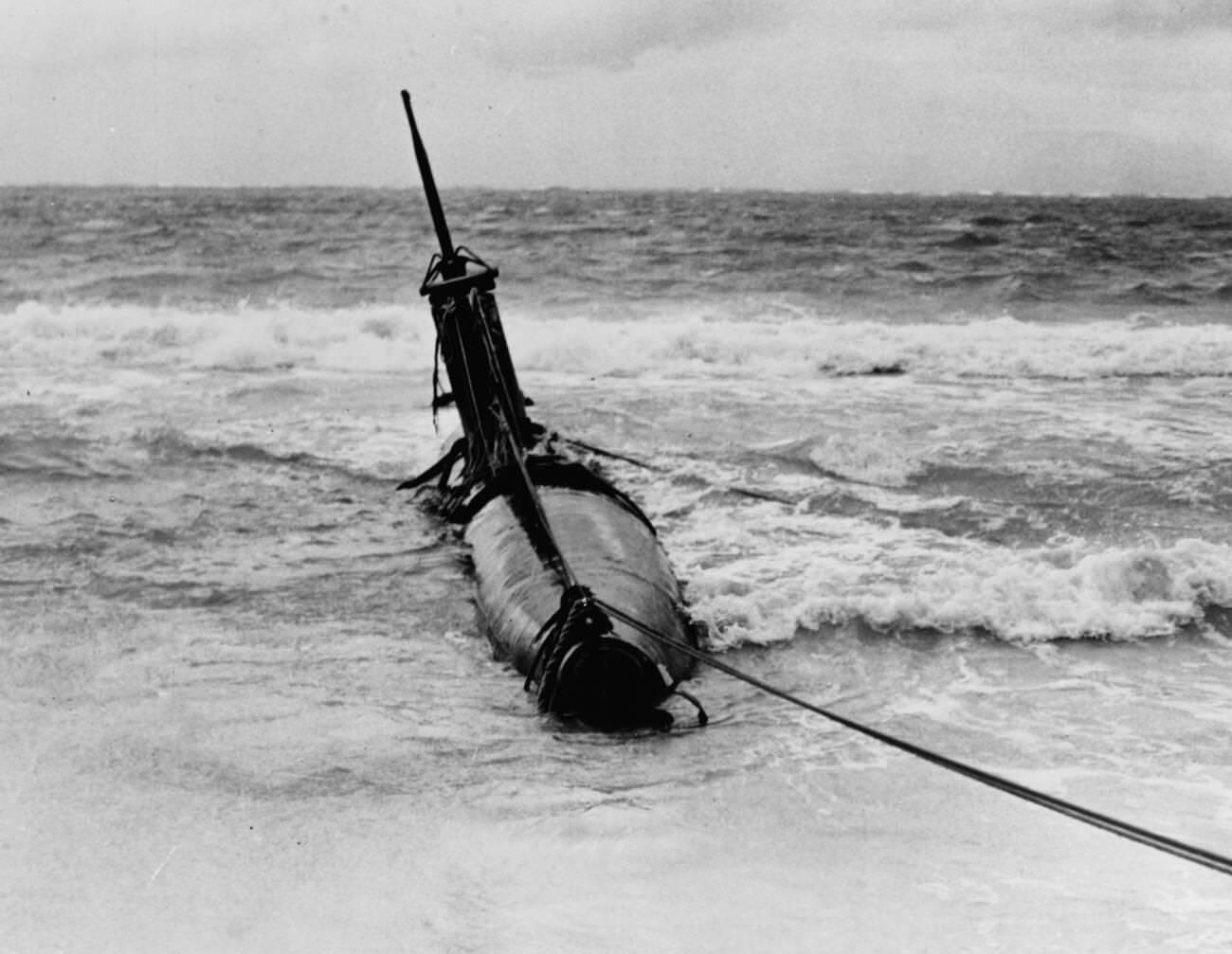 A Japanese Type A midget submarine beached in eastern Oahu after it grounded following attempts to enter Pearl Harbor during the December 7, 1941 Japanese attack, 1941.