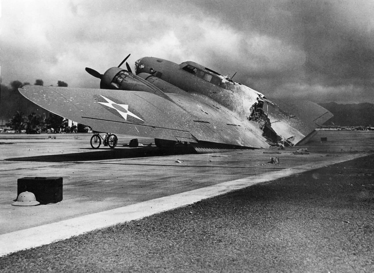 A burned U.S. Army Air Forces Boeing B-17C Flying Fortress at Hickam Field, Pearl Harbor on December 7, 1941.