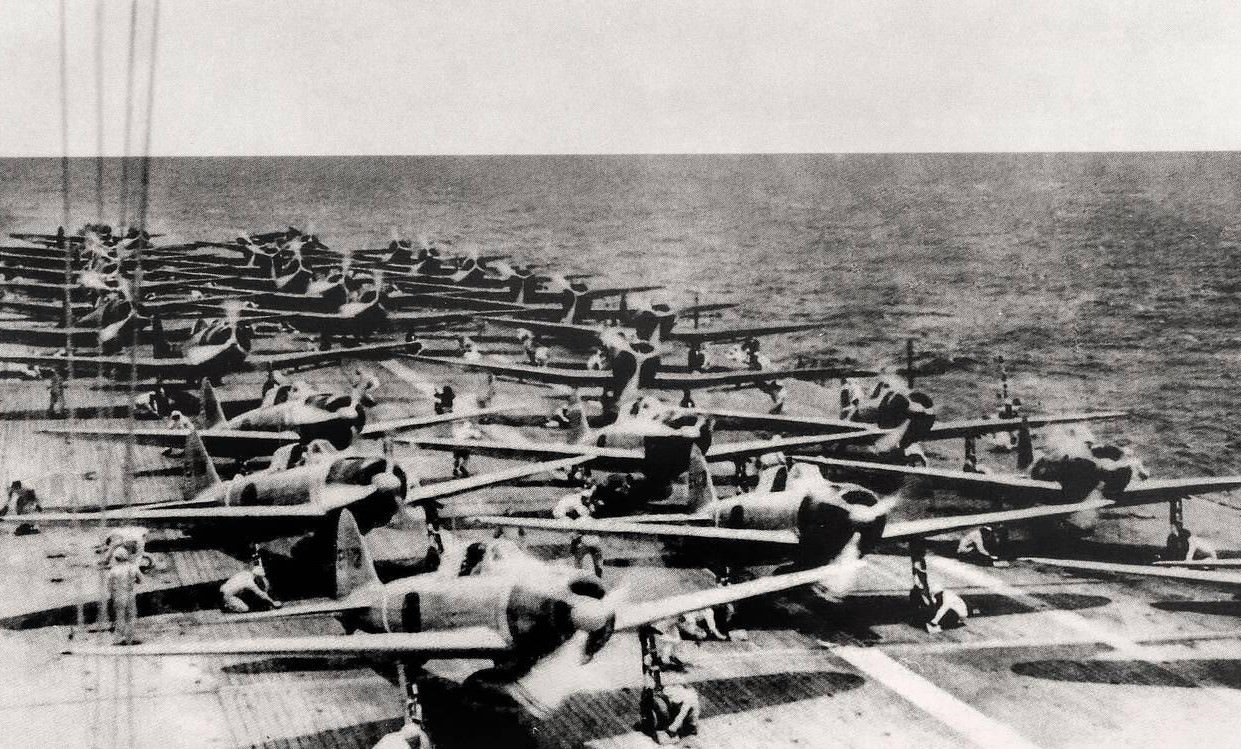 Japanese aircraft prepare to depart the Imperial Japanese Navy aircraft carrier Shokaku for the first wave of strikes at Pearl Harbor, 1941.