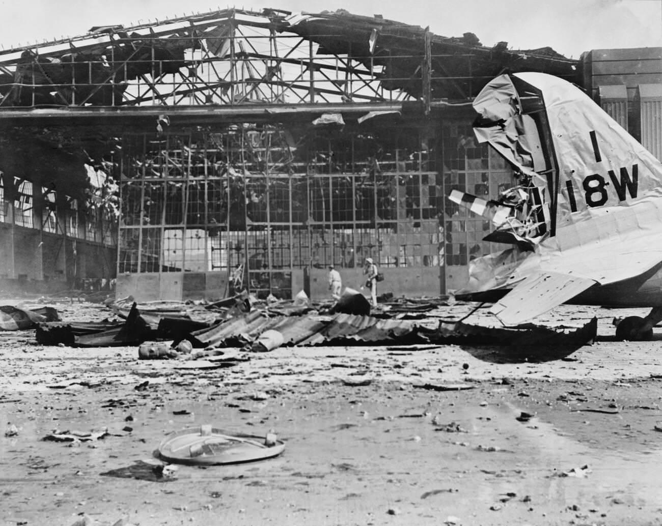 Damaged Hangar No. 11 after the Imperial Japanese Navy Air Service attack, Hickam Field, Pearl Harbor, Hawaii, 1941.