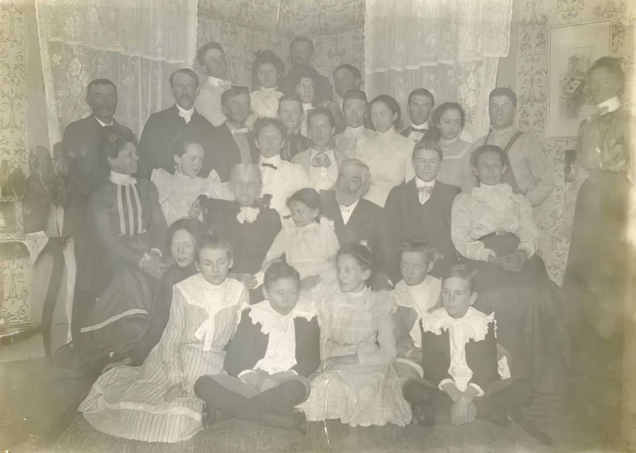 Large family in corner of room