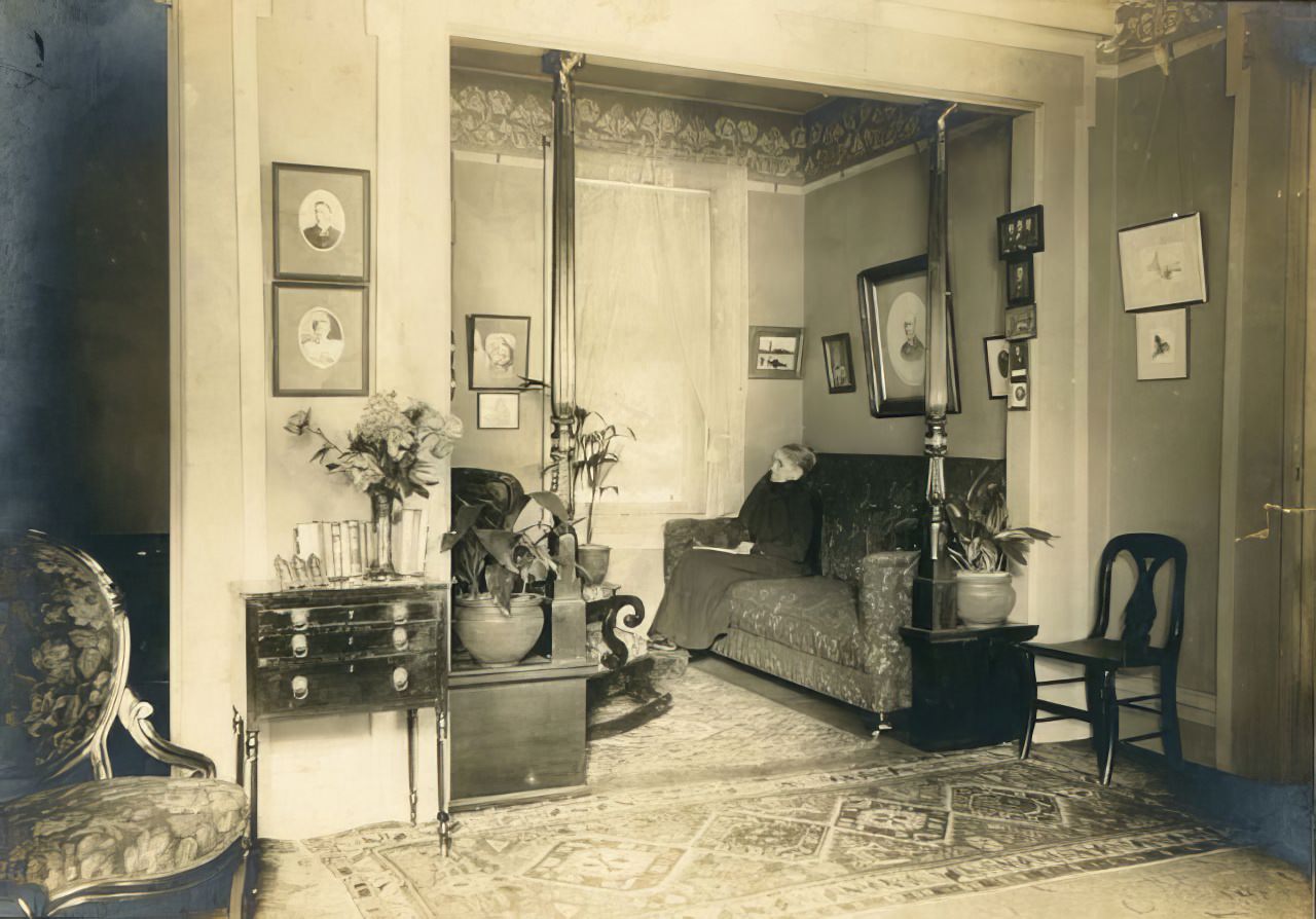 Woman seated in interior of alcove