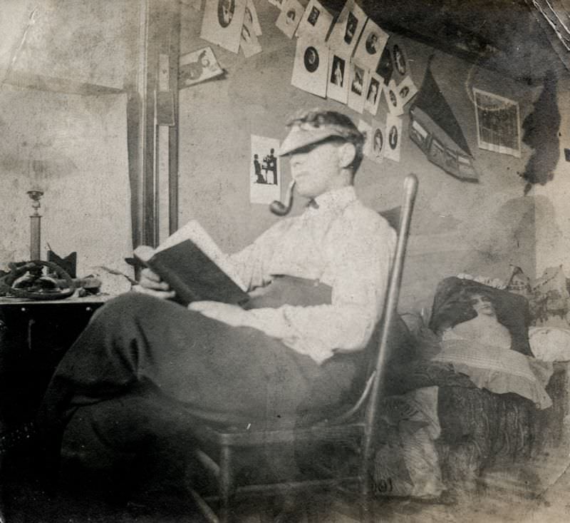 Man with a pipe reading a book