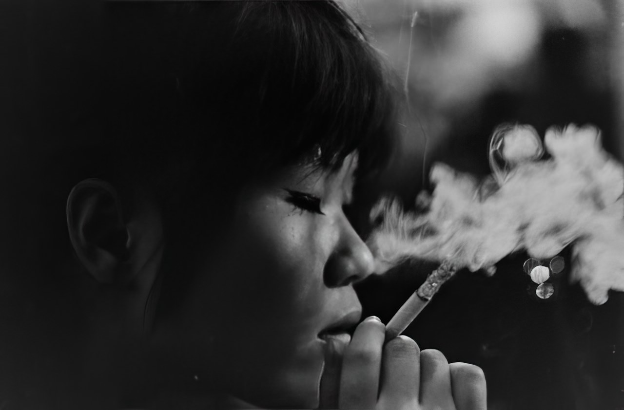 Kako, lost in a world of her own in a jazz shop in Tokyo, 1964.