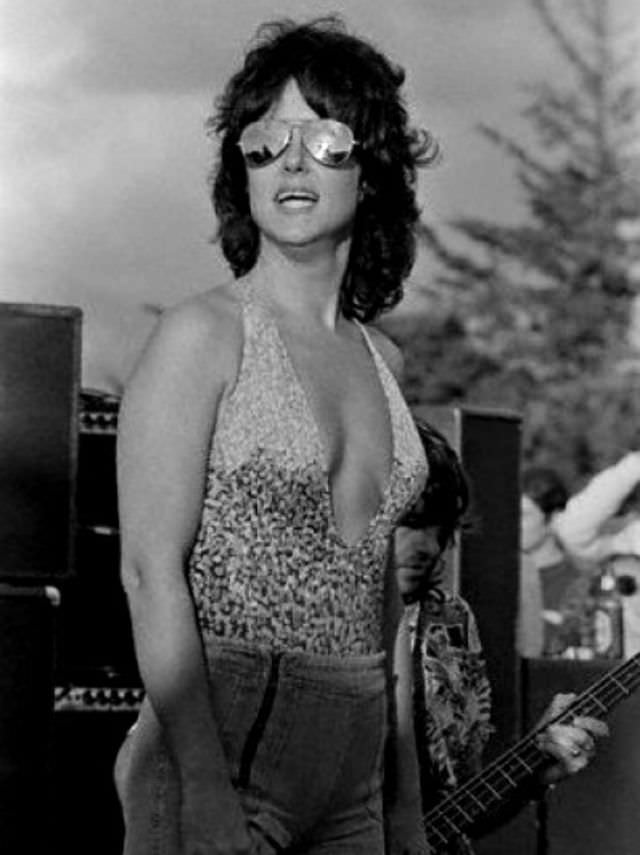 Grace Slick is wearing pants over her bathing suit, 1970