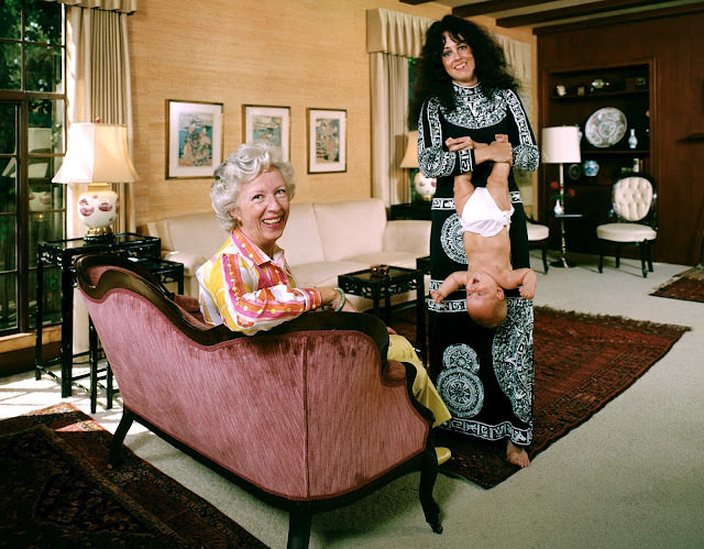 In one of the photos that ultimately ran in LIFE, new mom Grace dangles her daughter China by the feet in 1971.