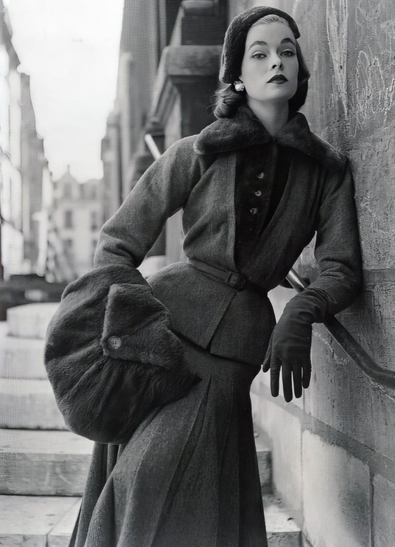 Susan Abraham in Fath's sophisticated tortoise-shell colored wool suit, 1952.