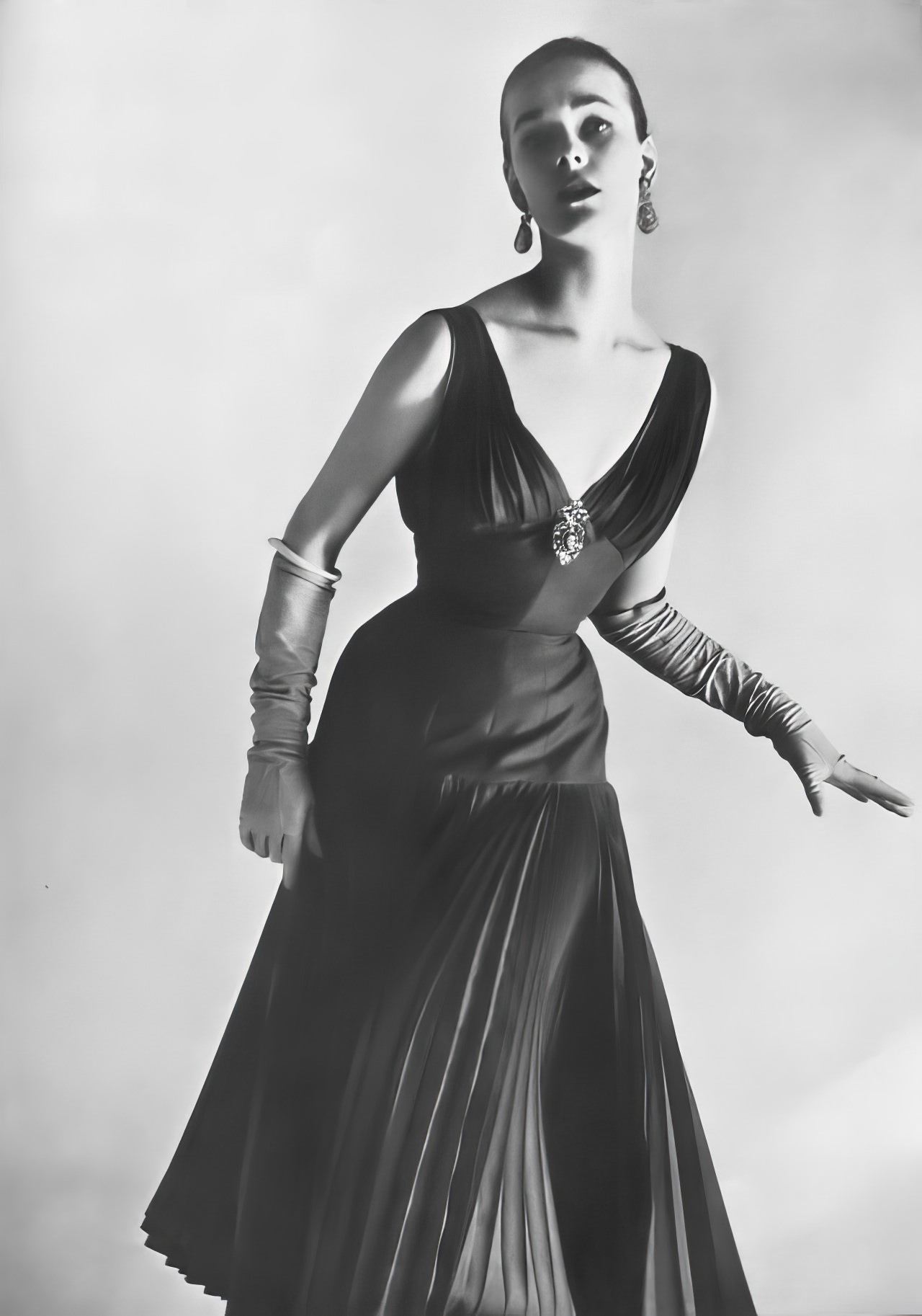 Susan Abraham in a raspberry silk and mohair dress, 1953.
