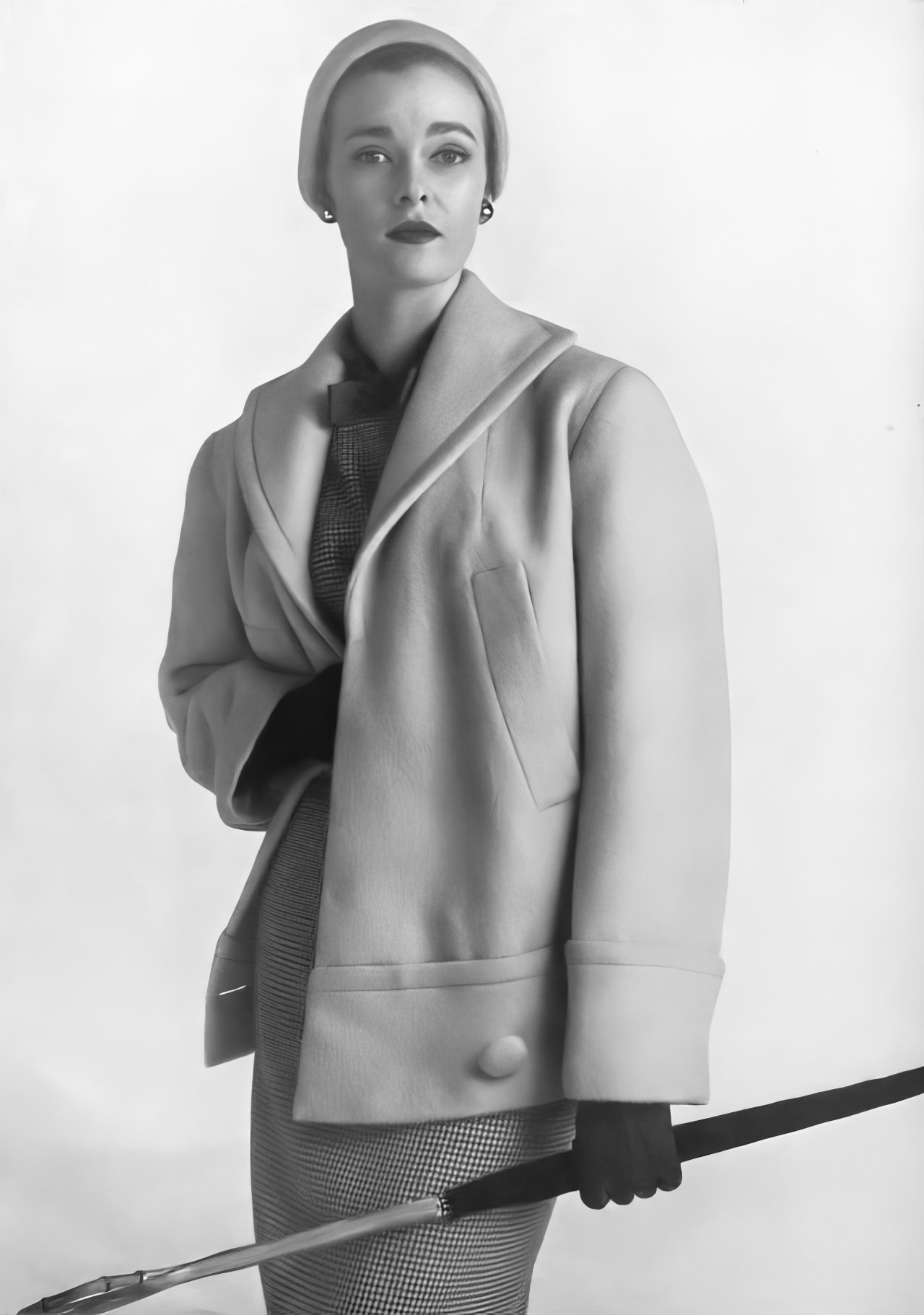 Susan Abraham in a short barrel coat of sulphur yellow brushed fleece, 1953.