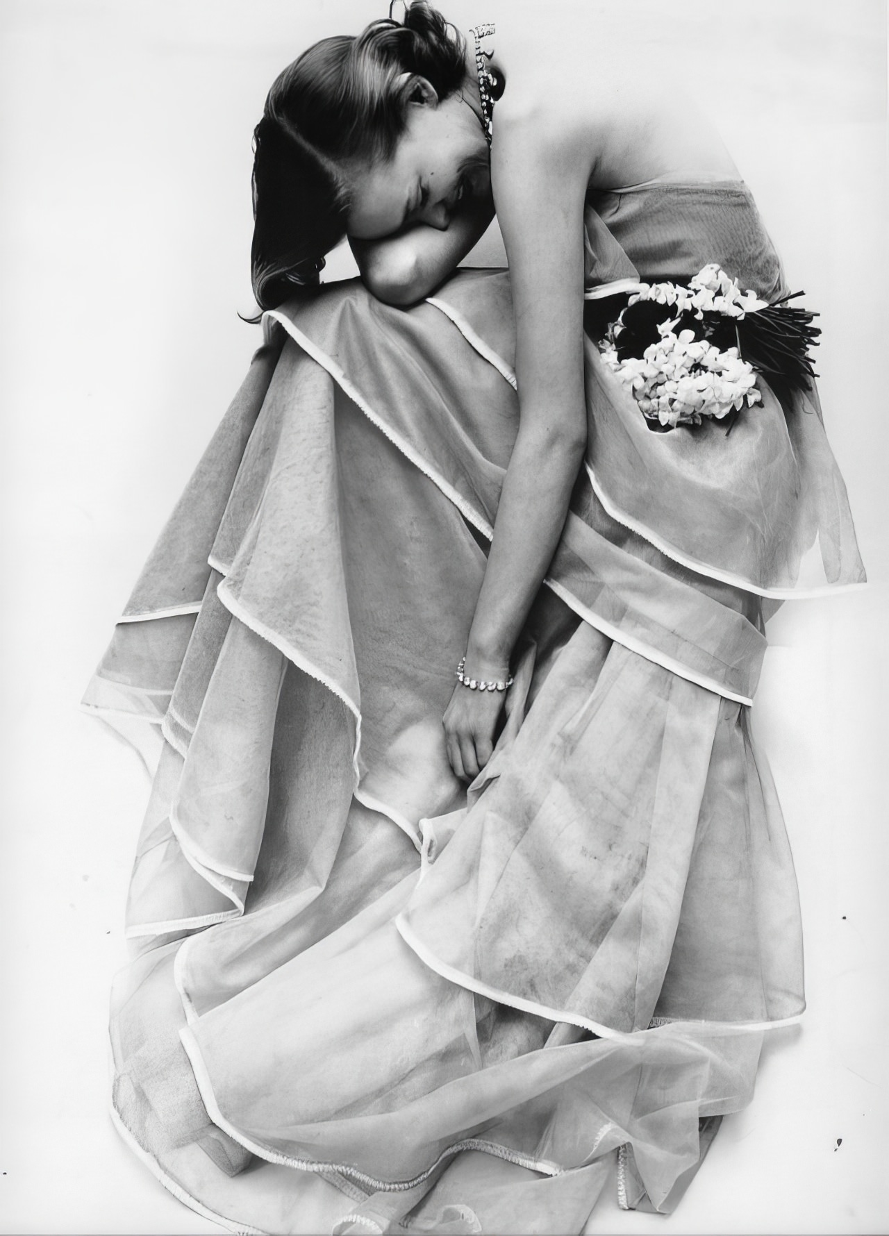 Susan Abraham in a sheer organdy tiered gown, 1951.