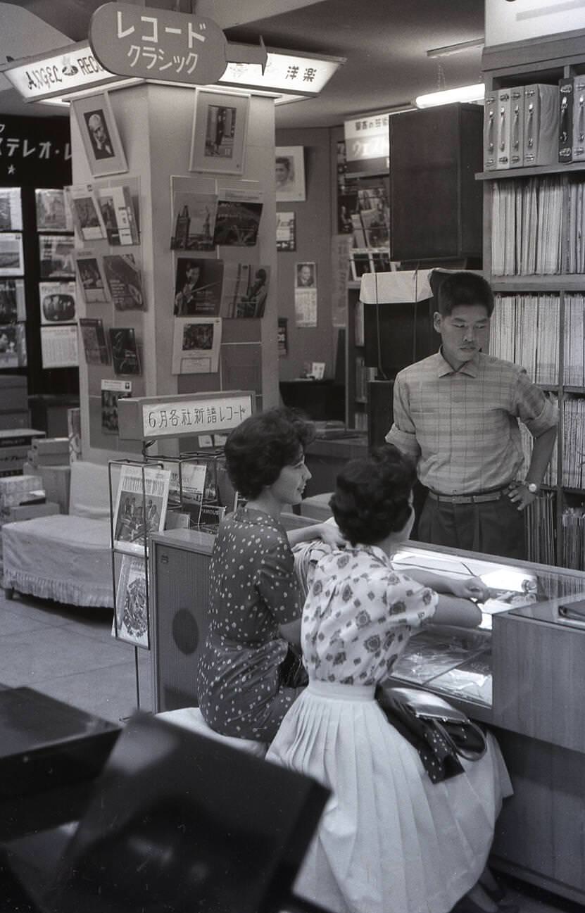 Two young Japanese women in a record store in Tokyo, 1959.