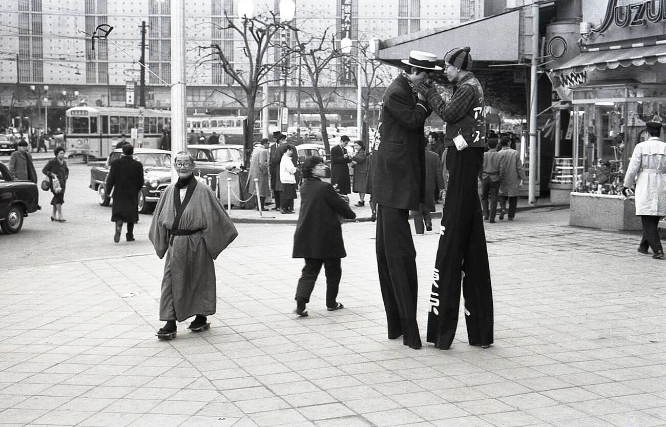Two men walking on stilts to promote a nearby business in Ikebukuro, Tokyo, 1957.