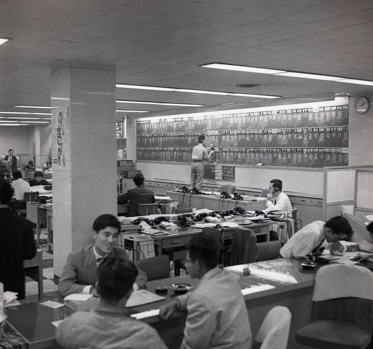 Staff working in a financial office in Tokyo, 1950s.