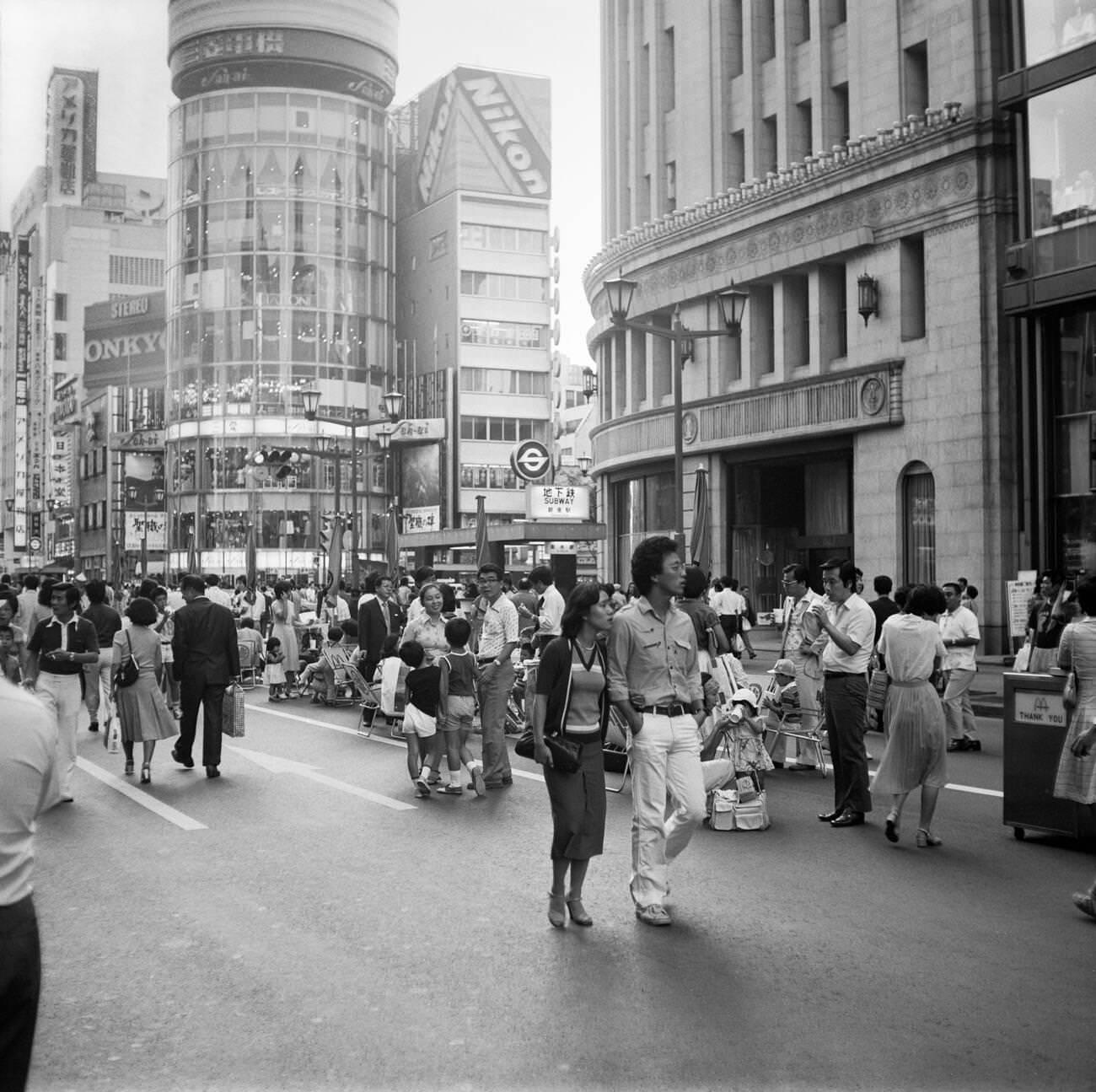 People walk down the street, Tokyo, 1978.