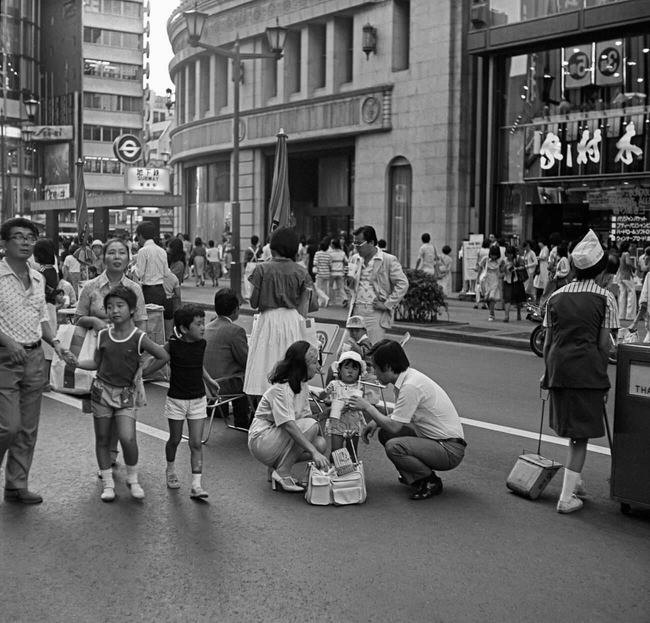 People walk down the street, Tokyo, 1978.