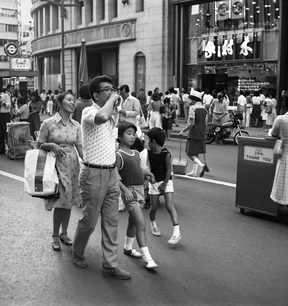 People walk down the street, Tokyo, 1978.