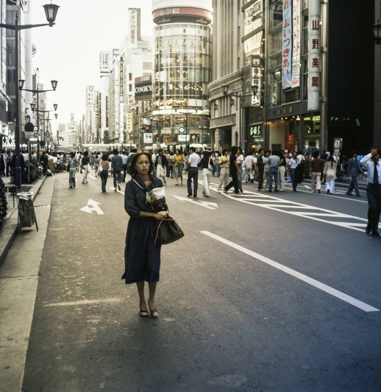 Woman walks down the street. Tokyo, 1978.