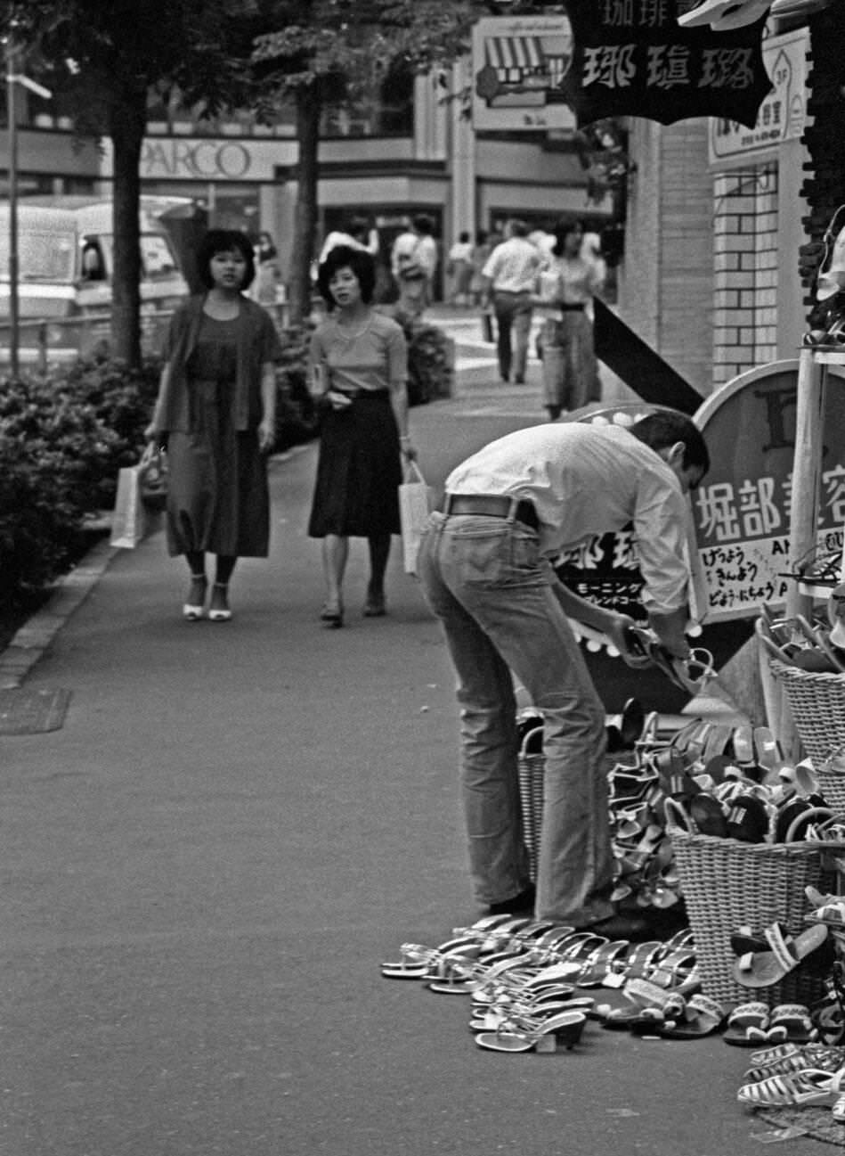 The merchant organizes his goods, Tokyo, 1979.