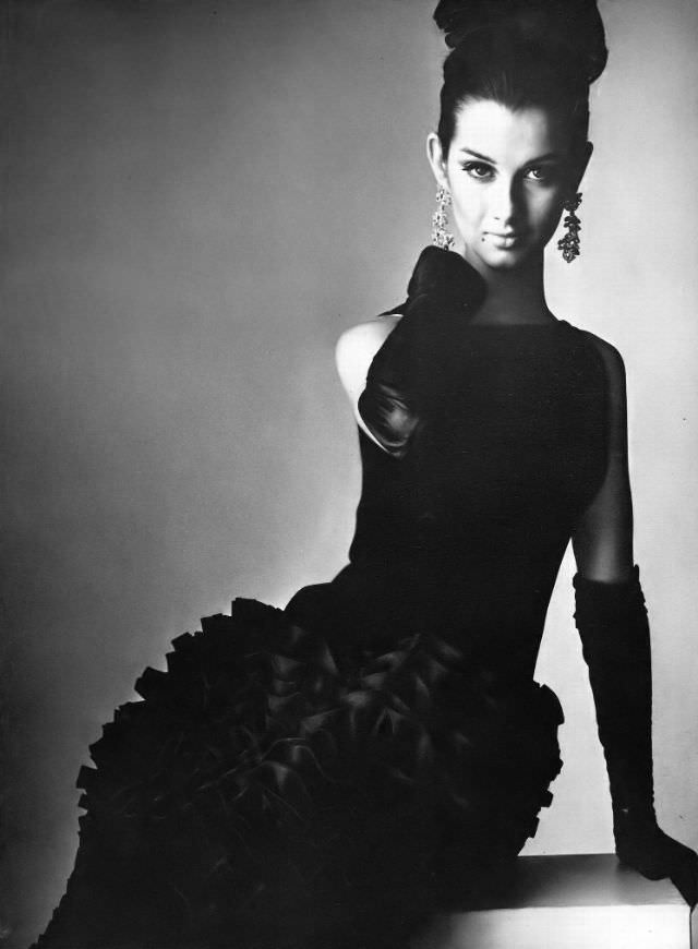 Veronica Hamel in a black crepe and organdie dress, 1964.