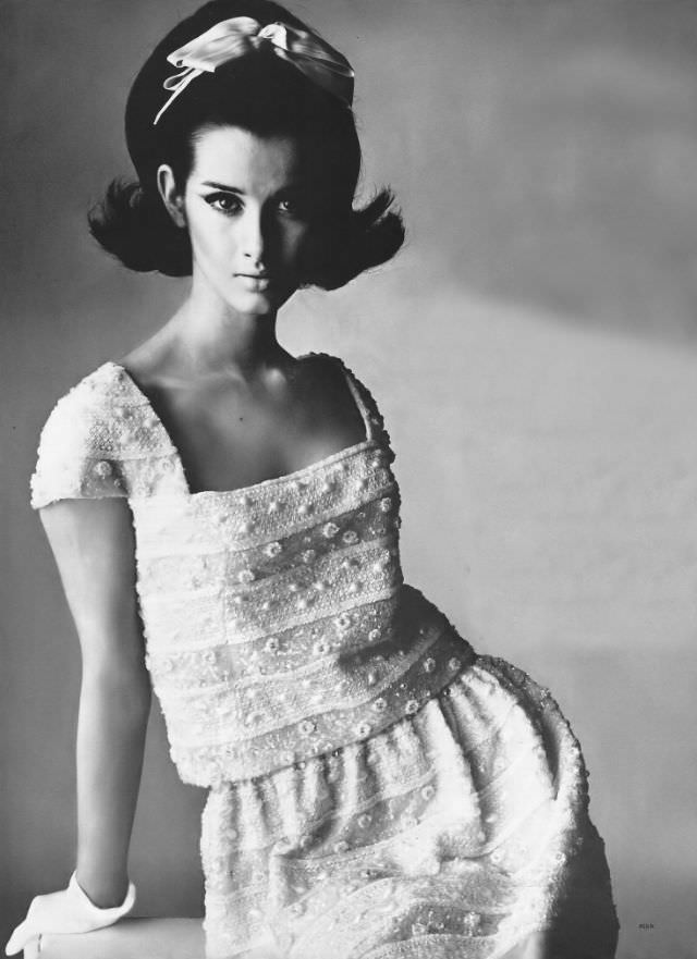 Veronica Hamel in a charming dress of thin white silk organdy, 1964.