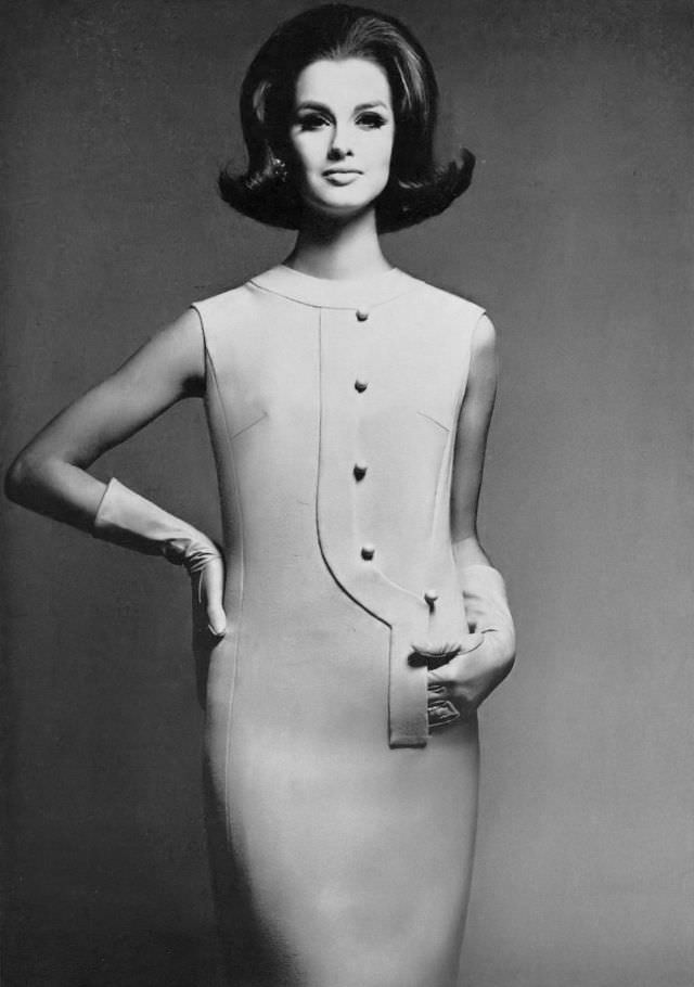 Veronica Hamel in a sleeveless sheath by Shannon Rodgers for Jerry Silverman, 1964.