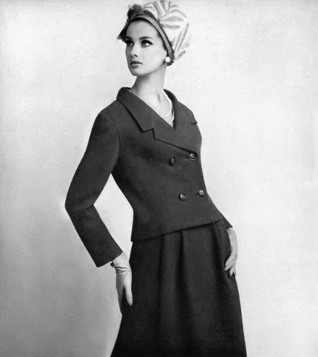 Veronica Hamel in a curved jacket and fluid skirt, 1965.
