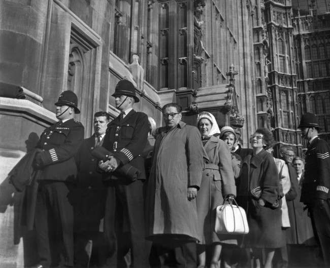 Playwright John Osborne (hands in pockets) who was one of the many arrested during an eight-hour ban-the-bomb sit-down demonstration in Trafalgar Square, London walks through London after being fined 1 at court, 1961.