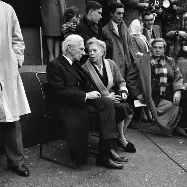 Lady Russell has a word with Earl Russell on the plinth of Nelson’s Column when they attended a meeting held by the Committee of 100, the anti-bomb organisation, in Trafalgar Square, London, to explain the Committee’s aims and principles, 1961.