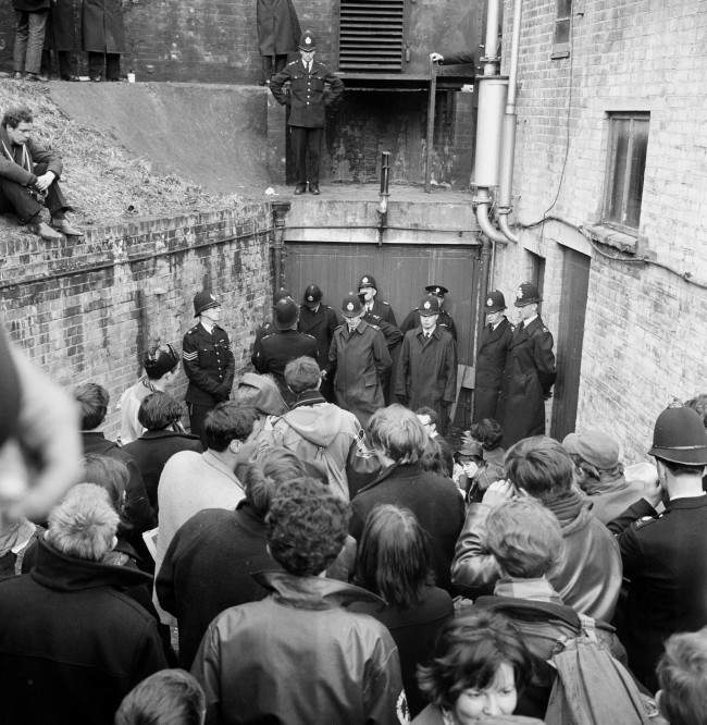 A double rank of policemen guards an entrance to a bunker type building in Berkshire, where nuclear disarmament demonstrators attempted to stage a protest, 1963.