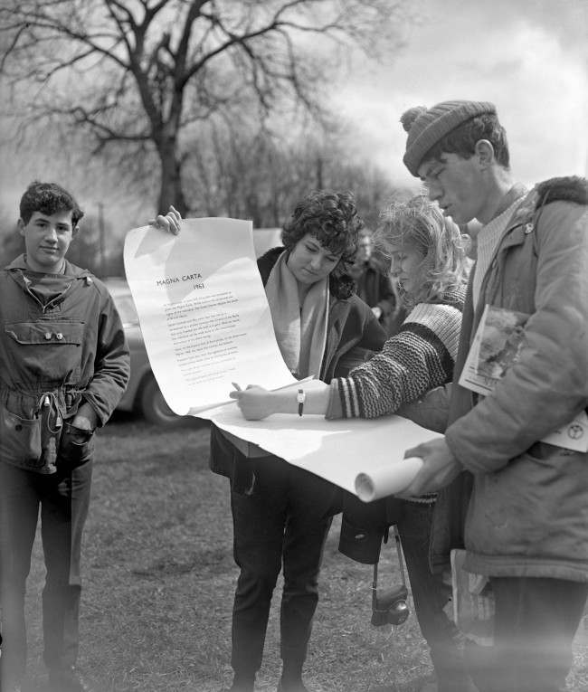 Some of the marchers sign a “Magna Carta 1963” at Runnymede, on the site of the signing of the original Magna Carta 750 years ago, 1963.