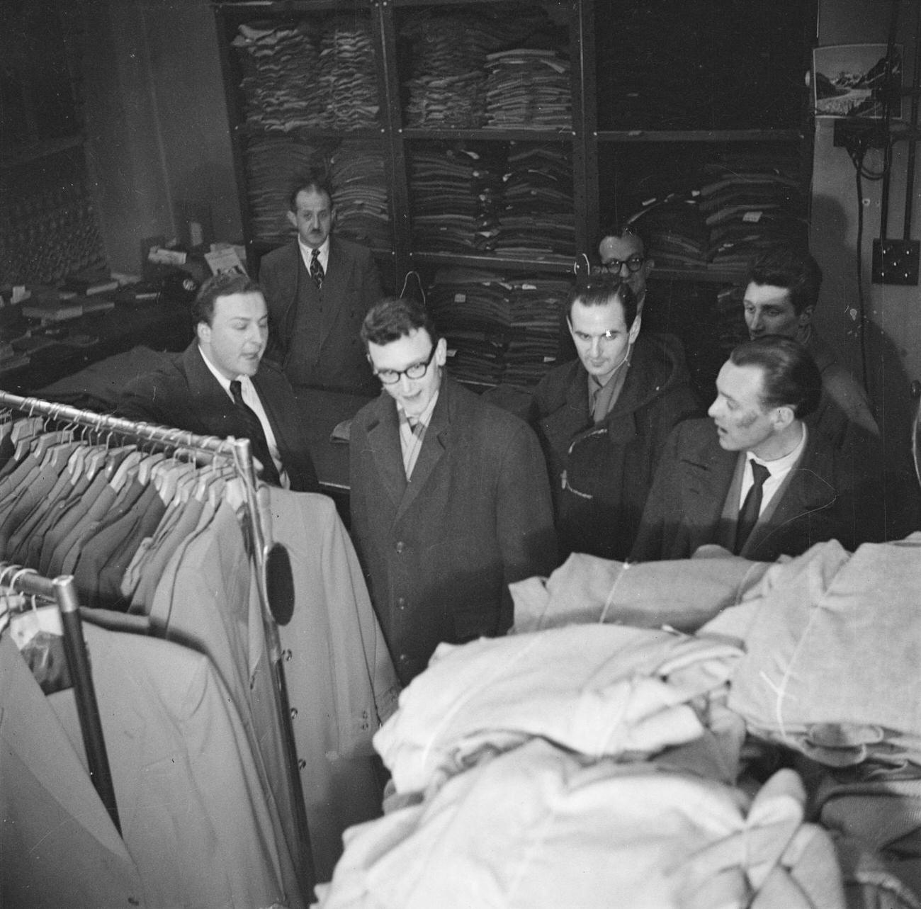 Jazz musicians in a mens clothes shop, including Ronnie Scott, Derek Humble and Benny Green by Nigel Henderson, 1954