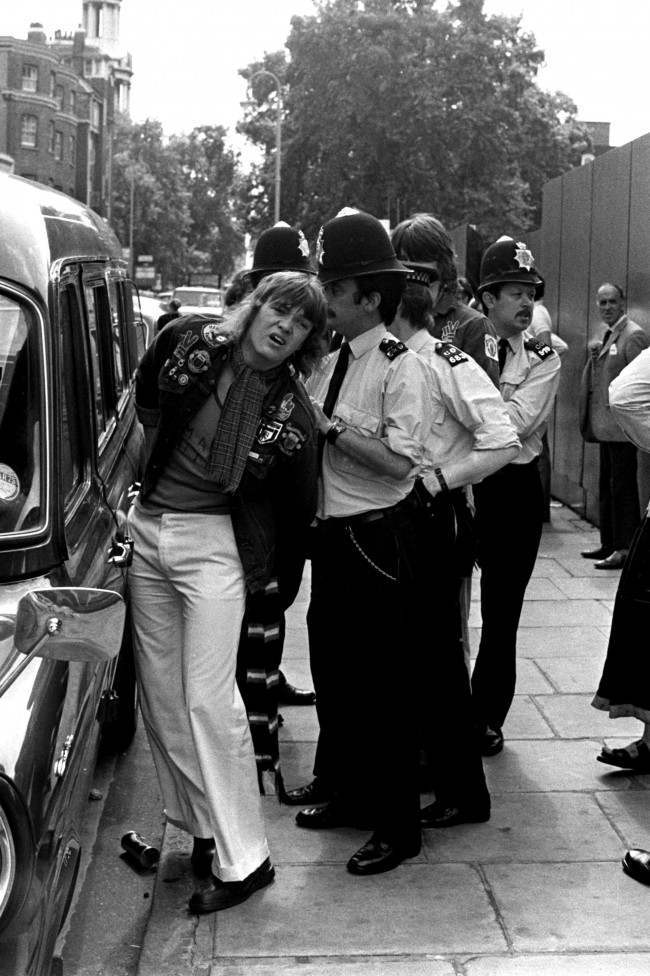 A Manchester United fan is arrested by a policeman after the riot, 1970s.