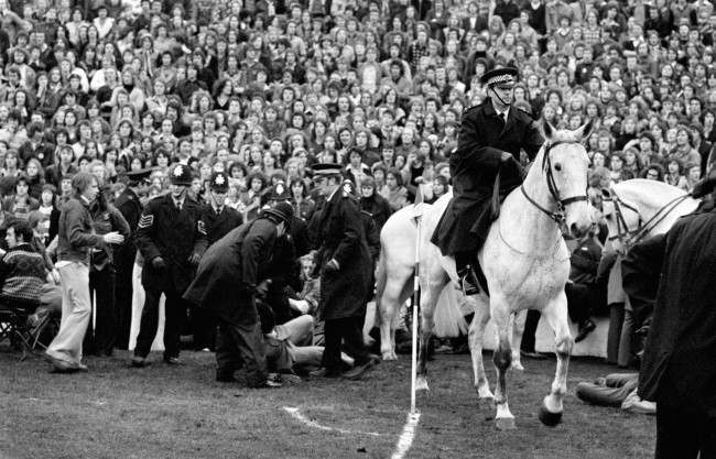 Mounted policemen help to deal with trouble making fans, 1970s.