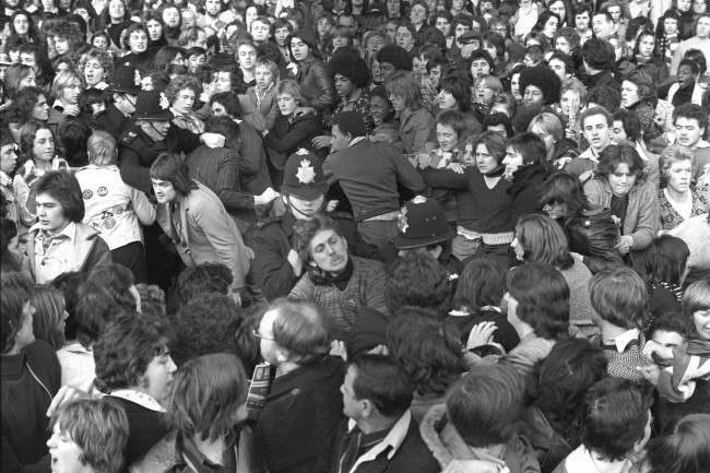 Police try to control the crowd at Highbury before Arsenal's match against Manchester United, 1970s.